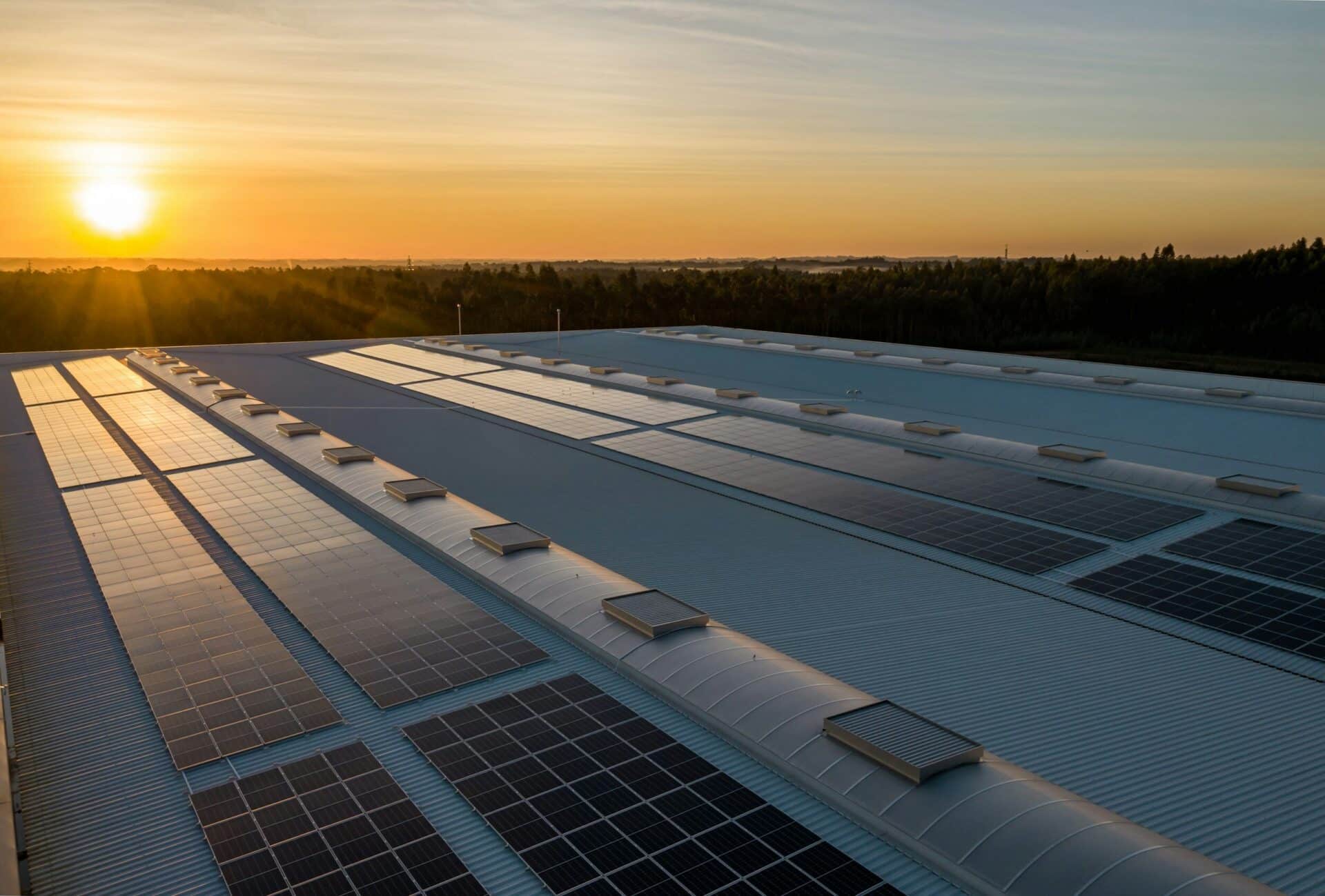 solar panels on roof at sunset